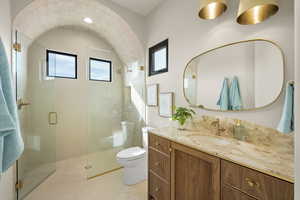 Bathroom with vanity and a stall shower