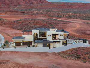 View of front of home featuring a fenced front yard, a chimney, stucco siding, and a mountain view
