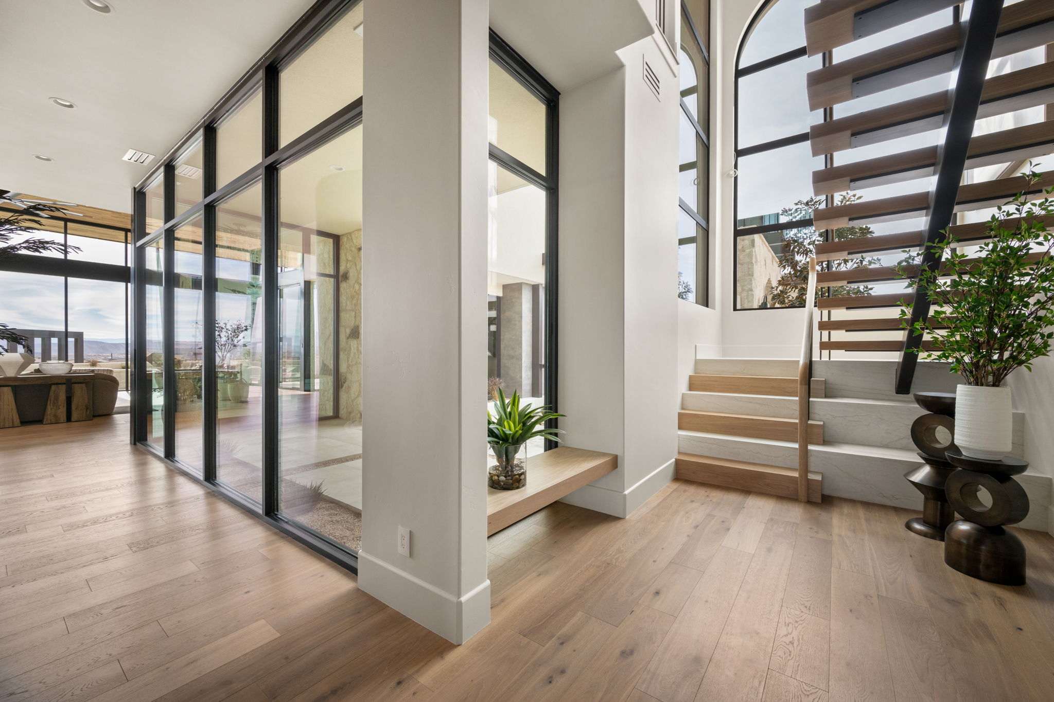 Community lobby featuring expansive windows and stairway