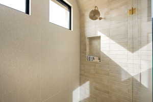 Bathroom with tiled shower
