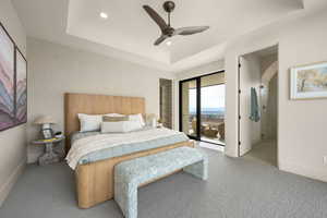 Carpeted bedroom featuring a ceiling fan, a raised ceiling, access to outside, and recessed lighting