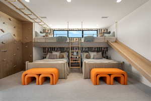 Carpeted bedroom with recessed lighting