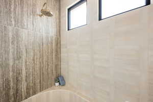 Bathroom view of shower / bathtub combination