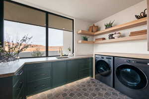 Laundry area with washing machine and dryer and cabinet space