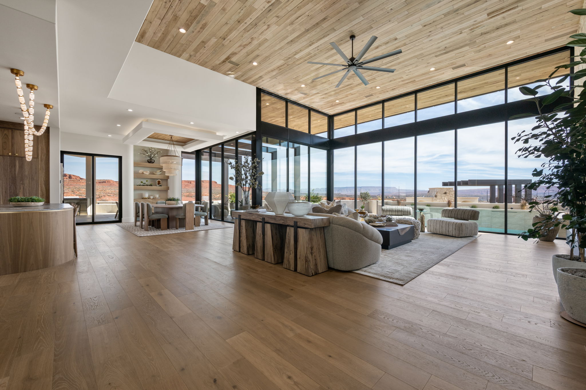 Living area featuring hardwood / wood-style floors, recessed lighting, a high wooden ceiling, expansive windows, and a ceiling fan