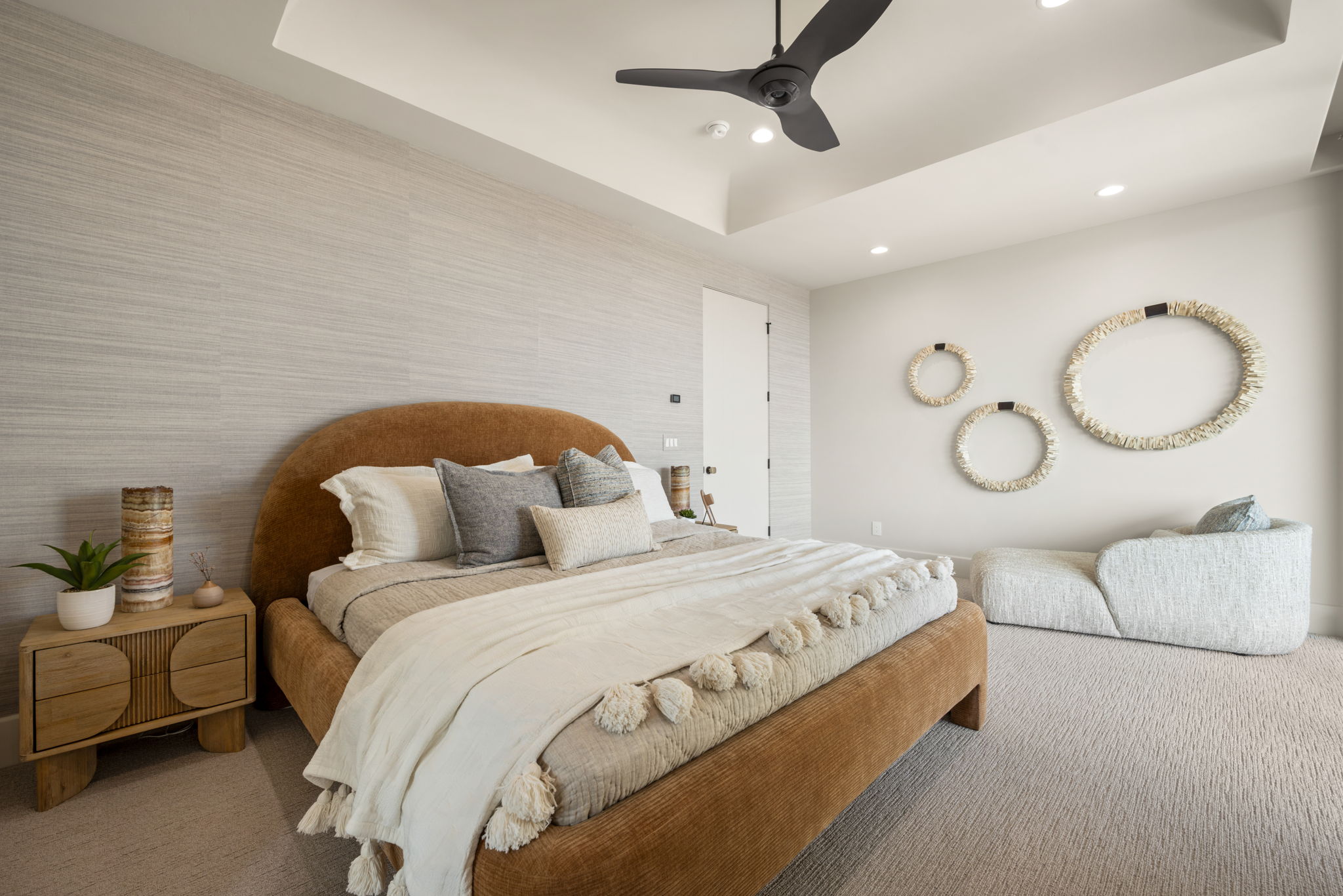 Bedroom featuring a tray ceiling, carpet flooring, ceiling fan, wallpapered walls, and recessed lighting