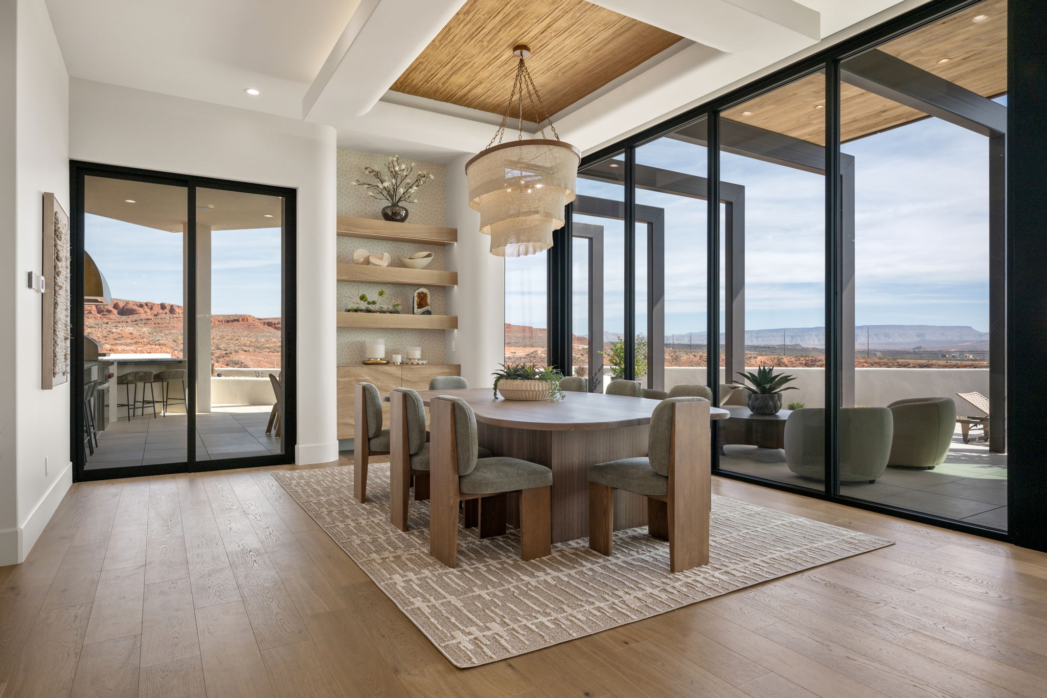 Dining room with light wood-type flooring, a wooden ceiling with exposed beams, recessed lighting, and a mountain view