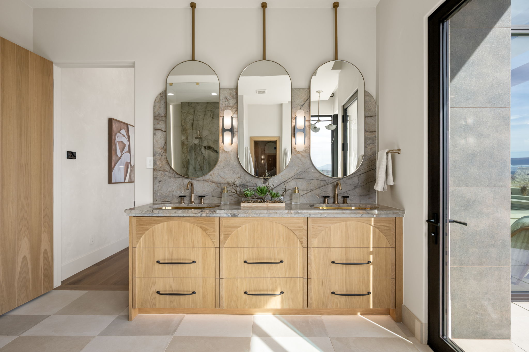 Full bath with double vanity, a shower, and backsplash