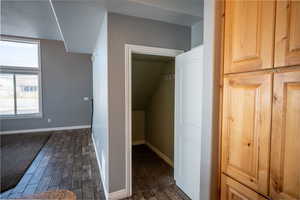 Bonus room featuring wood finish floors and baseboards