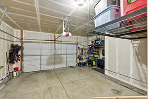 Garage featuring a garage door opener