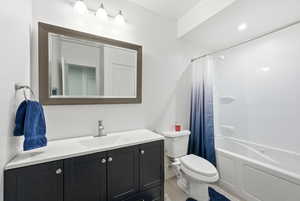 Full bath featuring vanity and shower / tub combo