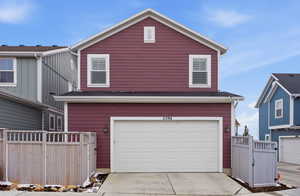 Garage featuring concrete driveway
