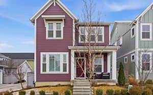 Traditional-style house with covered porch