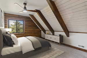 Bedroom featuring vaulted ceiling with beams, carpet flooring, rustic walls, wooden ceiling, and a ceiling fan
