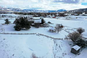 Snowy aerial view with a mountain view
