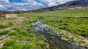 View of yard with a mountain view and a view of countryside