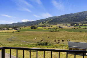 View of mountain background with rural landscape and agricultural land
