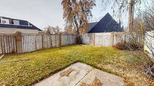 View of fenced backyard