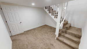 Staircase featuring carpet floors and recessed lighting