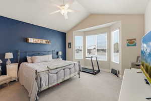 Carpeted bedroom with baseboards and ceiling fan