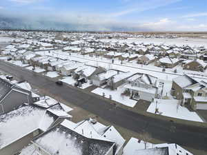 Snowy aerial view featuring a residential view