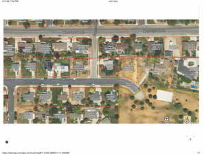 Aerial map of property and surrounding area featuring property boundaries.