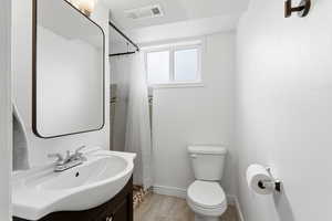 Full bath featuring vanity and a shower with curtain