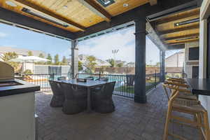 Fenced backyard with outdoor dining space and a patio