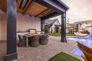 View of patio / terrace featuring outdoor dining space and grilling area