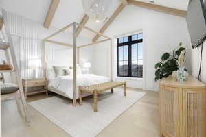 Bedroom featuring light wood finished floors and hanging lights
