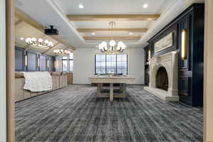 Dining area featuring billiards, plenty of natural light, dark carpet, a raised ceiling, and suspended lighting