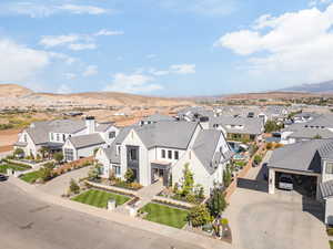 Aerial perspective of suburban area with a mountainous background