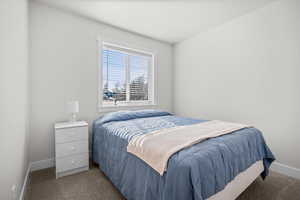Carpeted bedroom with baseboards