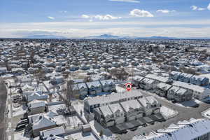 Aerial view of residential area featuring a mountain backdrop