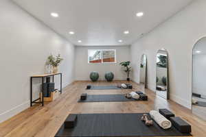 Workout room featuring recessed lighting