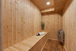 Sauna / steam room with wooden ceiling and recessed lighting