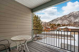 Second level deck featuring a mountain view and a residential view