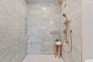 Full bathroom with tiled shower