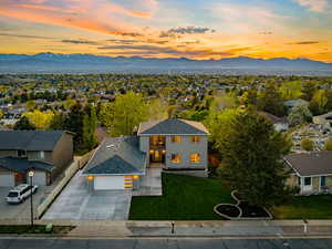 Aerial perspective of suburban area featuring a mountainous background