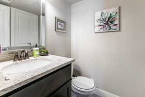 Bathroom with vanity and toilet