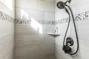 Bathroom featuring tiled shower