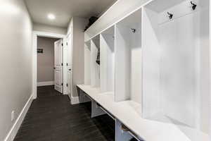 Mudroom with dark wood-style flooring and recessed lighting