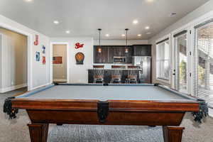 Recreation room with pool table, wet bar, recessed lighting, and carpet