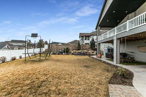 Fenced yard with a patio and a residential view
