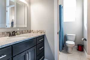 Bathroom featuring vanity and a shower with curtain