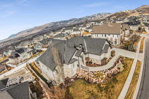 Aerial perspective of suburban area featuring a mountain backdrop