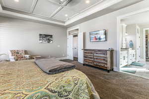Bedroom with coffered ceiling, carpet floors, and recessed lighting