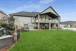 Rear view of house featuring a patio area, a fenced backyard, and roof with shingles