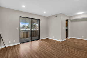 Spare room featuring wood finished floors and recessed lighting