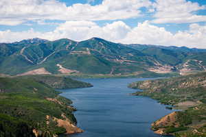 View of mountain backdrop featuring a large body of water